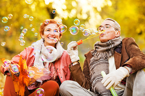 Experiencing joy can alter the course of your life. happy couple blowing bubbles