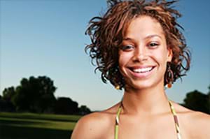 A happy woman smiling because she reversed her amenorrhea. happy woman smiling