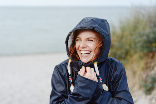 woman happy in winter at the beach