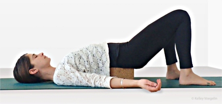 Supported Bridge Pose using one yoga block Supported Bridge Pose using one yoga block