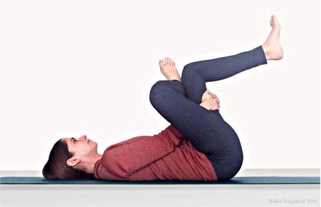 Woman in Supine Pigeon Pose (Supta Kapotasana) Woman in Supine Pigeon Pose (Supta Kapotasana)