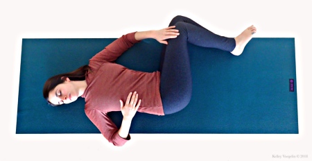 Woman in Supine Twist (Jathara Parivartanasana) Pose Woman in Supine Twist (Jathara Parivartanasana) Pose