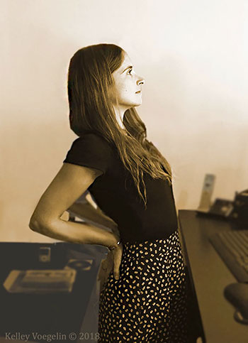 Woman doing Camel yoga pose at desk woman doing Camel yoga pose