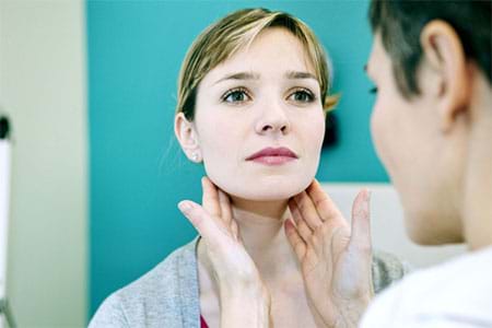 A doctor examining a woman’s lymph nodes. a doctor examining a woman’s lymph nodes